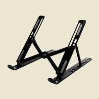 Belcrest black adjustable aluminum laptop stand with ergonomic design for improved posture and airflow.