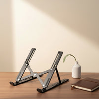 Belcrest black adjustable aluminum laptop stand with ergonomic design for improved posture and reduced strain.