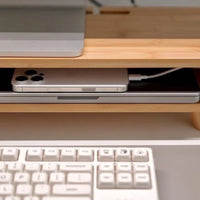 Belcrest bamboo monitor riser with drawer and open storage, holding a laptop and phone.