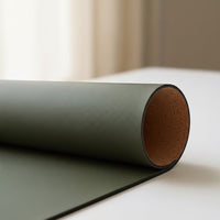 Belcrest reversible desk pad in olive green vegan leather on one side and natural cork on the other.