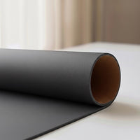 Belcrest reversible desk pad in black vegan leather on one side and cork on the other. Ideal for work and grip.