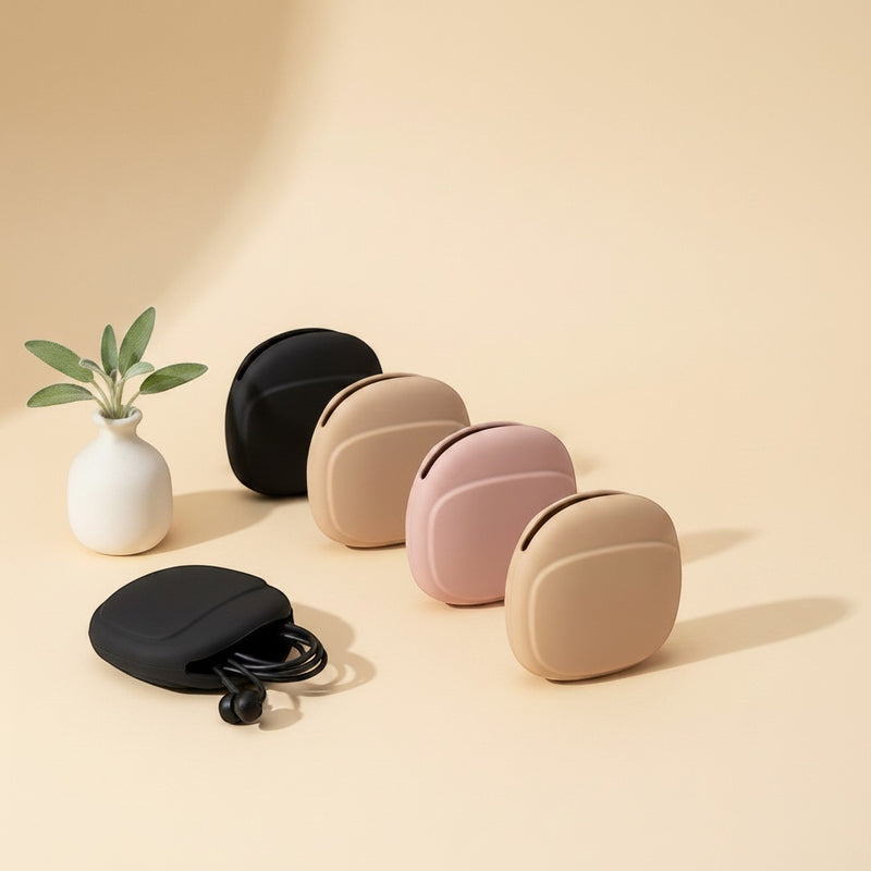 Belcrest silicone earbud carrying cases in black, beige, and pink. One case is open showing earbuds inside.