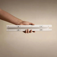 Belcrest white aluminum alloy adjustable standing desk cable management system with neodymium magnets.