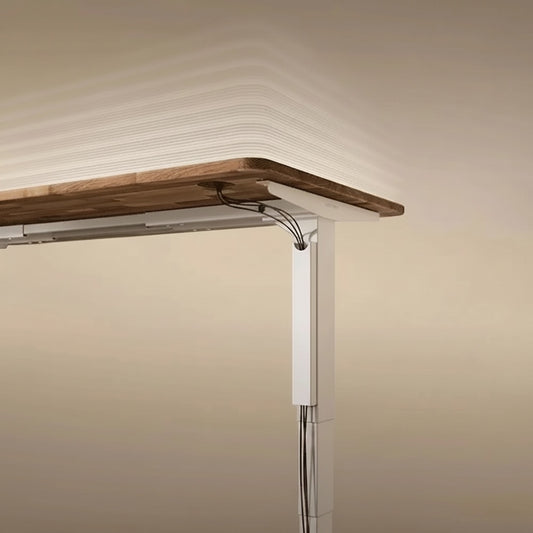 Belcrest adjustable standing desk cable management system in white aluminum alloy, keeping cables tidy.