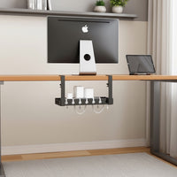 Belcrest black metal under desk retractable cable management tray with white cable organizers attached to a wooden desk.