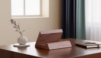 Belcrest solid walnut tablet and phone stand with a smooth, hand-finished surface and natural grain.