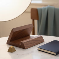 Belcrest solid walnut tablet and phone stand, natural wood grain, angled design for hands-free viewing.