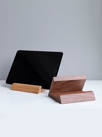 Belcrest solid walnut tablet and phone stand, natural wood grain, angled design for hands-free viewing.